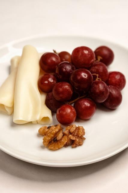 Provolone Cheese with Caramelized Walnuts and Grapes